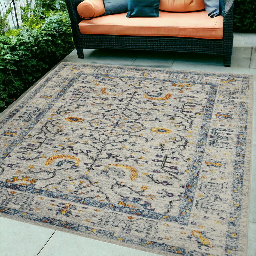 5' X 8' Ivory And Yellow Oriental Distressed Area Rug