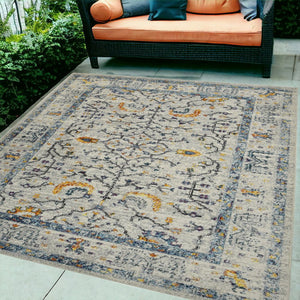 5' X 8' Ivory And Yellow Oriental Distressed Area Rug
