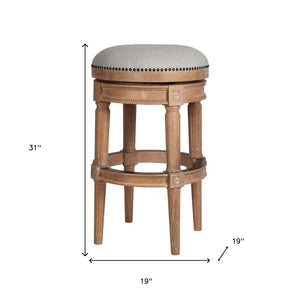 31" Beige And Natural Fabric And Solid Wood Backless Bar Height Swivel Bar Chair