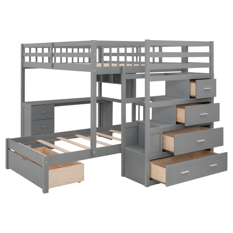 A gray L-shaped wooden frame bunk bed featuring an integrated desk, drawers, storage shelves, guardrails on the upper bunk, and an empty pull-out drawer beneath the lower bunk. Known as the Bunk Bed With Desk, Drawers And Shelves.