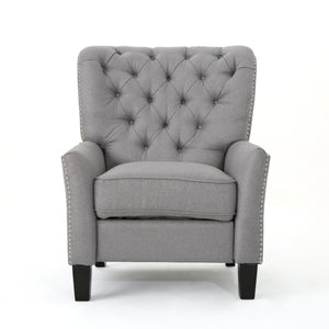 The Modern Push Back Recliner is a gray, tufted armchair with decorative buttons and nailhead trim. It has a cushioned seat, high back, and dark wooden legs, set against a plain white background.