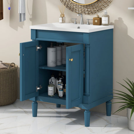 The Bathroom Vanity With Top Sink and 2-Tier Modern Bathroom Storage Cabinet in blue features a white sink and gold knob handles. It displays open shelves with bottles, soap dispensers, decor, a round mirror, and a wicker basket on a marble-tiled floor.