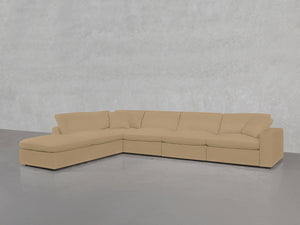A 6-Seat Modular Corner Lounger Sectional in beige with five seat cushions and matching back cushions, arranged against a light gray textured wall on a smooth gray floor.