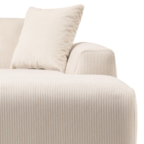 Close-up of the Mar - High-Quality Sectional Sofa in cream-colored textured corduroy with a matching cushion. The ribbed fabric gives a plush look, showing the armrest and seating area against a plain white background.