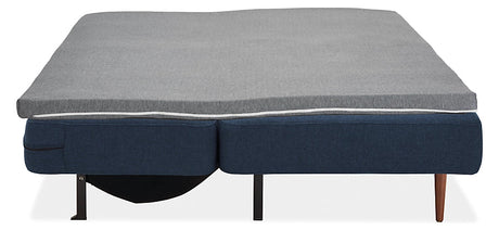 Introducing the Deco Convertible Sleeper Sofa: a contemporary blue sofa bed equipped with a light gray mattress topper. It features an easy folding mechanism that transforms it into a flat sleeping position, supported by sleek black metal and wooden legs.