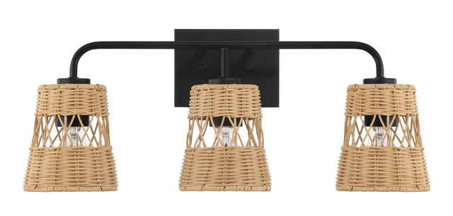 The Moonlit 3 Lights Wall Sconce features a black metal frame and woven rattan cylindrical shades with a lattice pattern, offering a warm, natural look while partially revealing the bulbs for your bathroom lighting over the mirror.