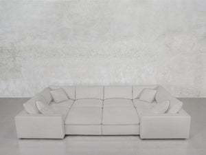 The 8-Seat Modular Closed Pit, in light gray with four matching cushions, is arranged against a plain textured light gray wall and a smooth gray floor.