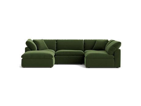 The Bryant U-Sofa Bumper Sectional is a spacious, dark green sectional sofa featuring a left-side chaise. Its plush and minimalist design is complemented by multiple cushions, all set against a simple black background.