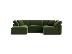 The Bryant U-Sofa Bumper Sectional is a spacious, dark green sectional sofa featuring a left-side chaise. Its plush and minimalist design is complemented by multiple cushions, all set against a simple black background.