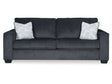 The Altari Queen Sofa Sleeper is a sleek and modern piece in dark gray, featuring two large back cushions and two throw pillows with leaf patterns. It showcases wide armrests and is supported by short, blocky legs for a contemporary look.