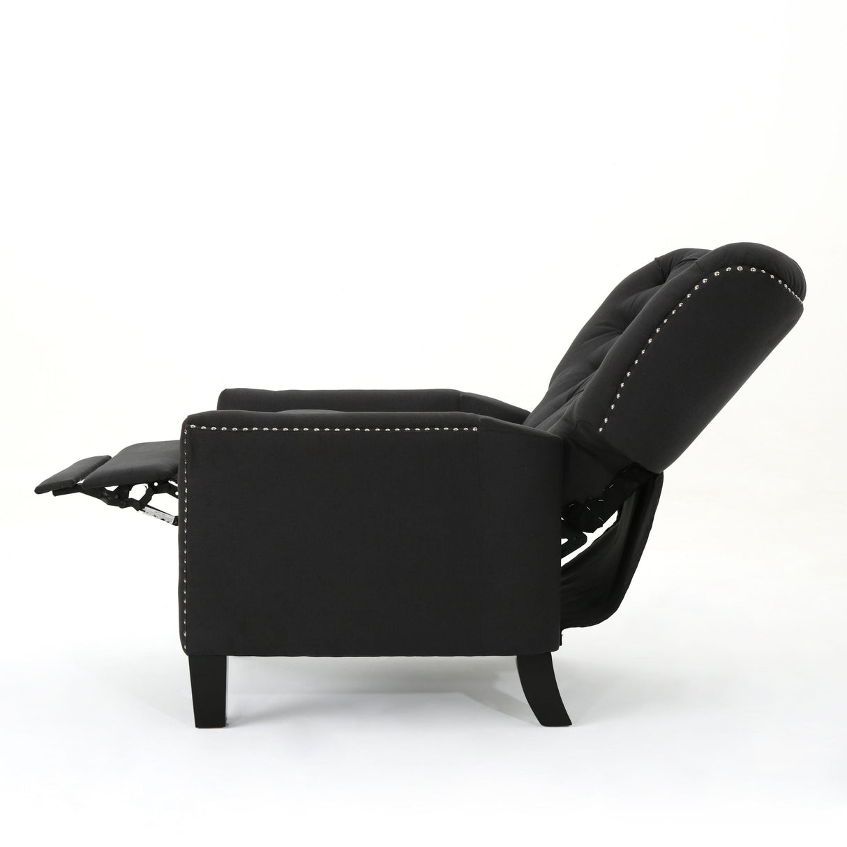 The Modern Push Back Recliner is depicted in a side view, showcasing its black tufted backrest and extended footrest. Its sleek design features nailhead trim along the edges, all set against a plain white background.