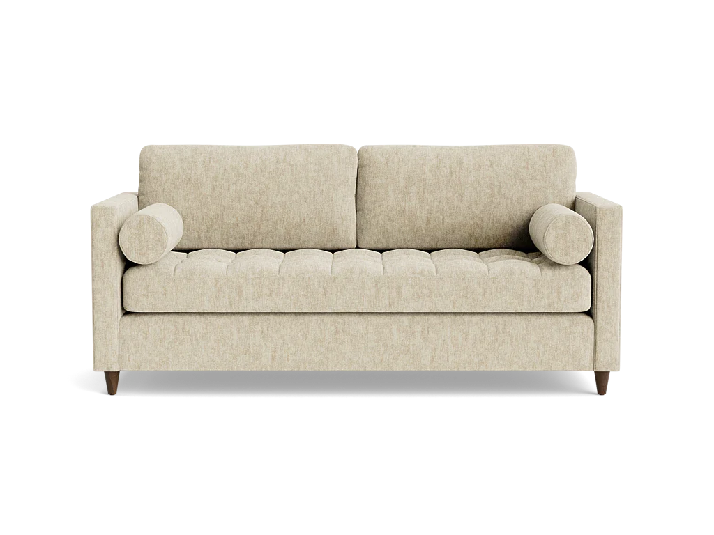The Briar Sleeper Sofa, featuring a beige finish with a tufted seat, two rectangular back cushions, and cylindrical bolster pillows on either side, is set against a black background.