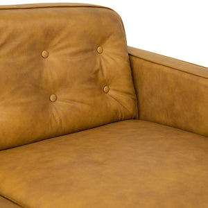 Close-up of a Braxton Tan Sofa, showcasing its angular armrests, tufted backrest with two buttons, and matte-finished smooth texture with a cushioned seat.