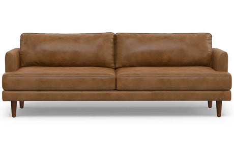 The Livingston 90-Inch Mid Century Sofa is a brown leather piece with a sleek design, featuring two seat cushions, two back cushions, and wooden legs. This sofa exudes a modern and comfortable ambiance, making it perfect for a stylish living room.