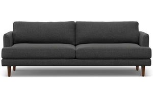 The Livingston 90-Inch Mid Century Sofa boasts a modern design with dark gray upholstery and wooden legs. It includes two seat cushions and two back cushions, all crafted from soft, textured fabric. The minimalist style is highlighted against a white background.