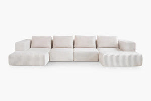 The Atlas Modular Sofa by Acanva is a contemporary sectional sofa featuring off-white ribbed upholstery, square cushions, and a low-profile design. It is composed of five interconnected segments, making it ideal for a spacious living area.