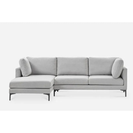 A modern light gray sectional sofa with an L-shaped design, featuring plush cushions and a chaise on the left side. The sofa has sleek black legs and is set against a plain white background.