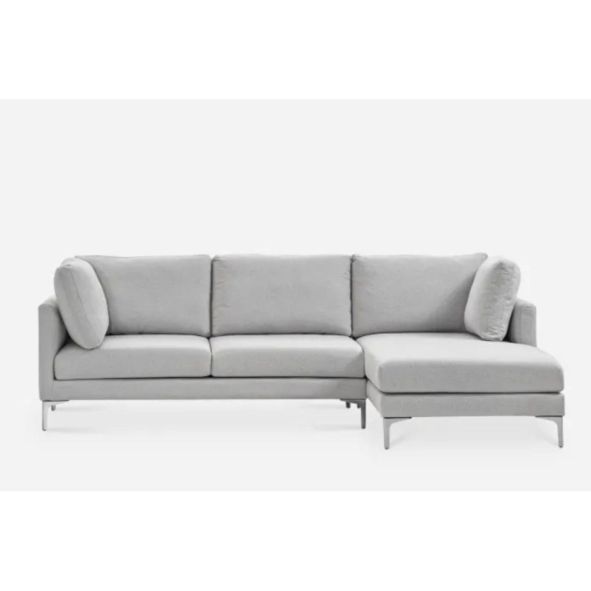 A modern gray sectional sofa with an L-shaped design. It features three seat cushions, two back cushions, and additional side cushions. The sofa has sleek metal legs and a minimalist style, set against a plain white background.