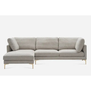 A modern gray sectional sofa with a chaise on the left side. The sofa has three back cushions and wooden legs, set against a plain white background.