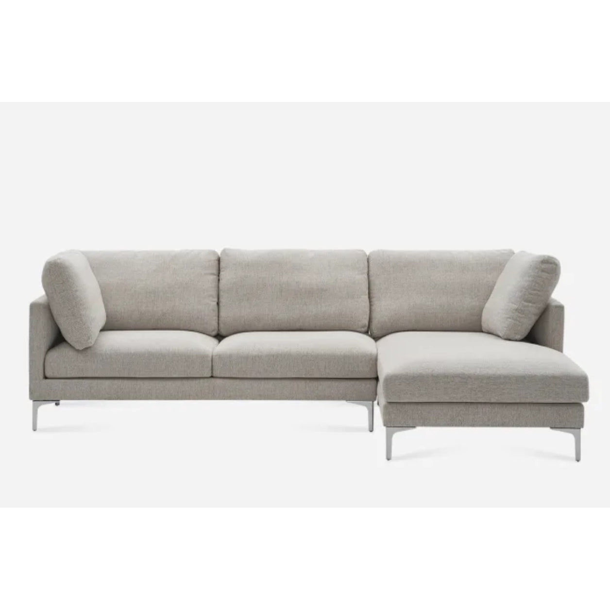 A gray L-shaped sectional sofa with metal legs, featuring three back cushions and a chaise on the right side. The sofa has a modern and minimalist design, set against a plain white background.