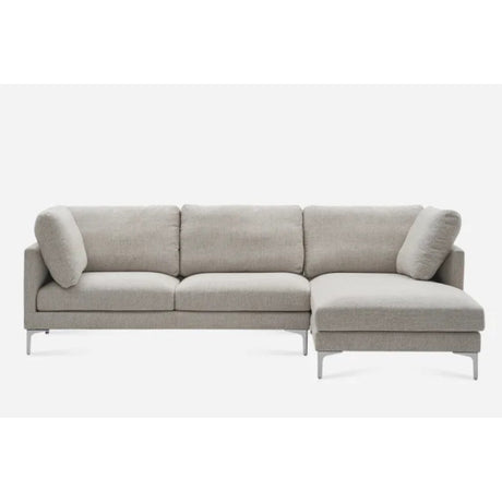 A gray L-shaped sectional sofa with metal legs, featuring three back cushions and a chaise on the right side. The sofa has a modern and minimalist design, set against a plain white background.