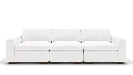 A sleek, minimalist 106" Like Butter sofa in luxurious Enzo/Cream leather, featuring plush cushions and blocky wooden legs, set against a plain white background.