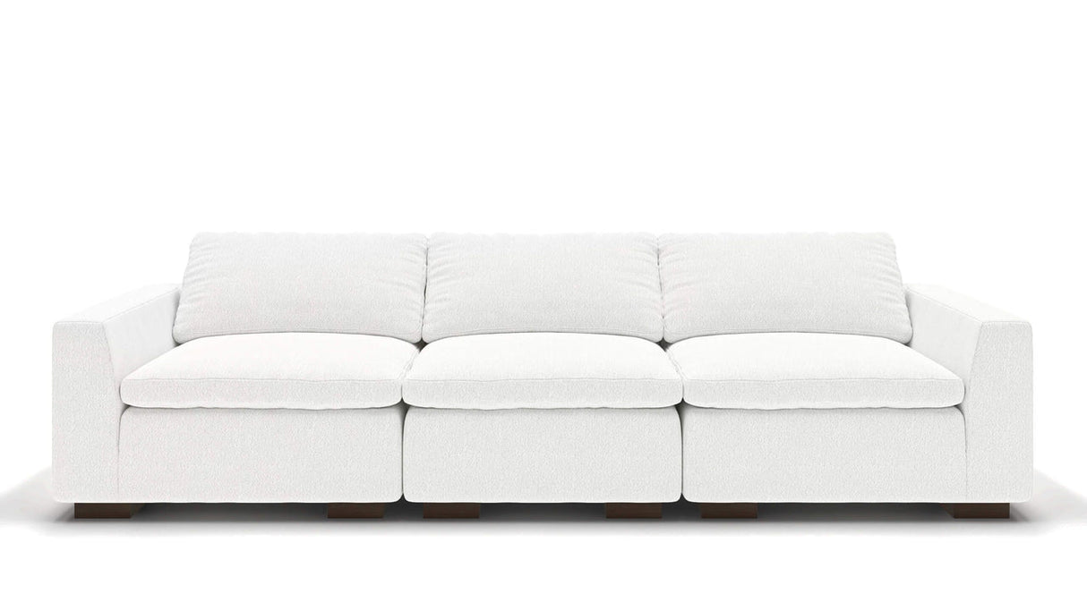 A sleek, minimalist 106" Like Butter sofa in luxurious Enzo/Cream leather, featuring plush cushions and blocky wooden legs, set against a plain white background.