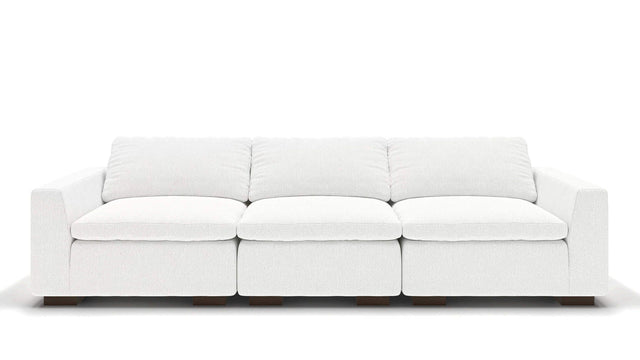 A sleek, minimalist 106" Like Butter sofa in luxurious Enzo/Cream leather, featuring plush cushions and blocky wooden legs, set against a plain white background.