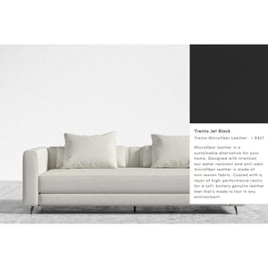 The Berlin Sleeper Sofa is a modern piece in light gray, featuring two large cushions against a minimalist backdrop. Made from sustainable Trento microfiber leather and designed for durability, it is priced at $427.