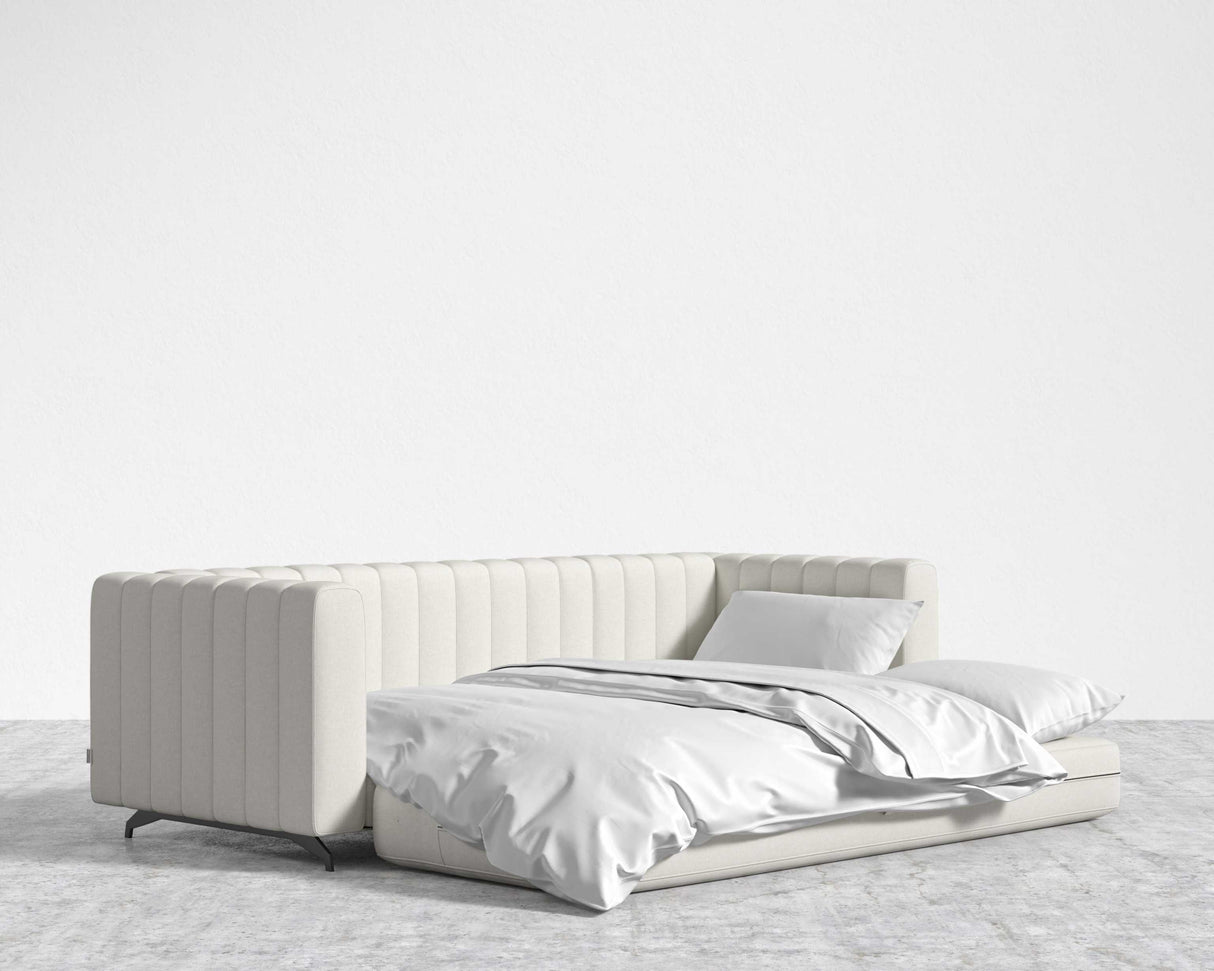 A Berlin Sleeper Sofa in white with a matching bed.