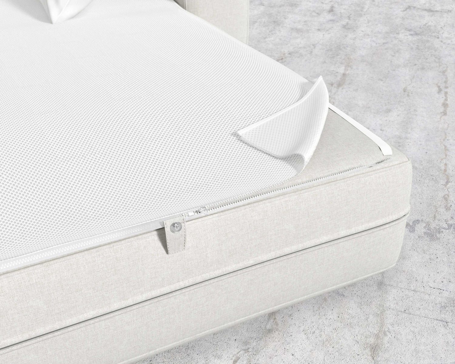 The image features a close-up of a white zippered cover, partially open to reveal the mesh inner layer beneath. This Berlin Sleeper Sofa rests on a light-colored fabric bed base set against a concrete-looking floor.