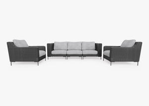 The Black Wicker Outdoor Sofa with Armchairs - Five Seat set offers a contemporary design, showcasing a three-seater sofa and two matching armchairs. These pieces feature sleek dark wicker frames paired with light gray cushions, all set against a pristine white background.