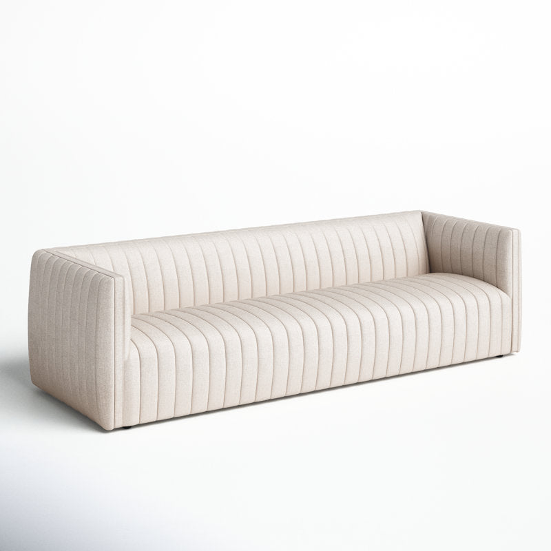 The Brandt 97'' Upholstered Sofa is a modern, beige three-seater featuring vertical stitching and a low backrest, all set against a white background. The design emphasizes clean lines and a contemporary aesthetic.