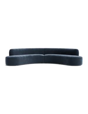 The Cara Sectional Sofa features a curved design in dark blue velvet with no visible legs, set against a black background. It boasts a sleek, minimalist aesthetic with smooth lines and a modern appearance.