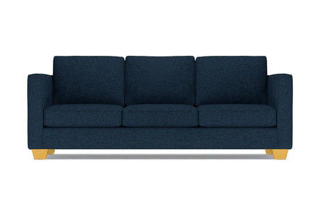 The Catalina Sofa is a dark blue three-seater featuring square cushions and light wooden legs, set against a white background.