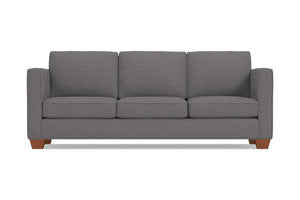 The Catalina Sofa is a gray, three-seater piece with a minimalist design and wooden legs. It features straight arms and three back cushions, set against a plain white background.