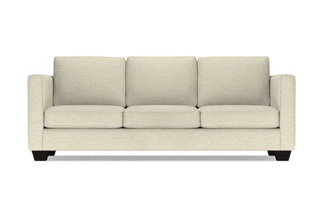 Introducing the Catalina Sofa: a three-seater in beige with square cushions and armrests, featuring black wooden legs, elegantly showcased against a white background.