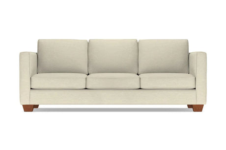 The Catalina Sofa is a beige three-seater featuring square cushions and wooden legs. It showcases a modern, minimalist design and is displayed against a plain white background.