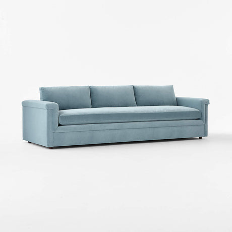 Ceva 103" light blue performance velvet sofa with a modern, streamlined design, featuring three seat cushions and three back pillows. Displayed against a plain white background.