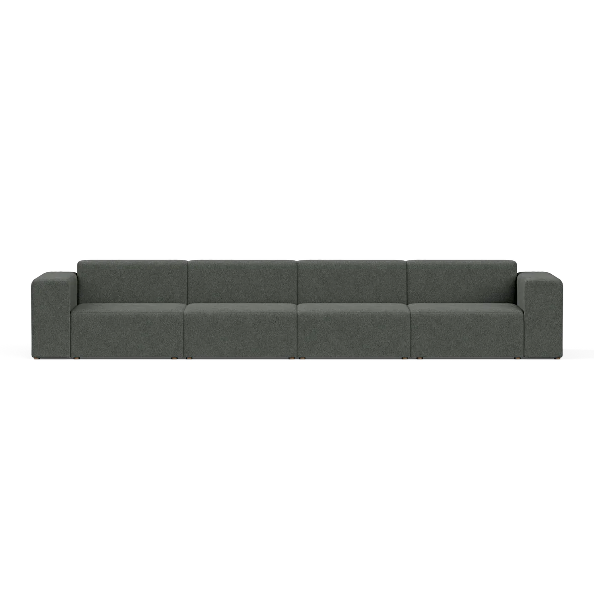 The Four-Seater Form Sectional is a long, modern sofa in dark gray featuring four evenly spaced sections and boxy armrests, set against a plain white background. Its minimalist design provides ample seating space.