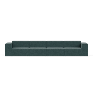 The Four-Seater Form Sectional is a spacious dark green modular sofa with six sections, featuring armrests on both ends, set against a plain white background and boasting a minimalist and contemporary design.