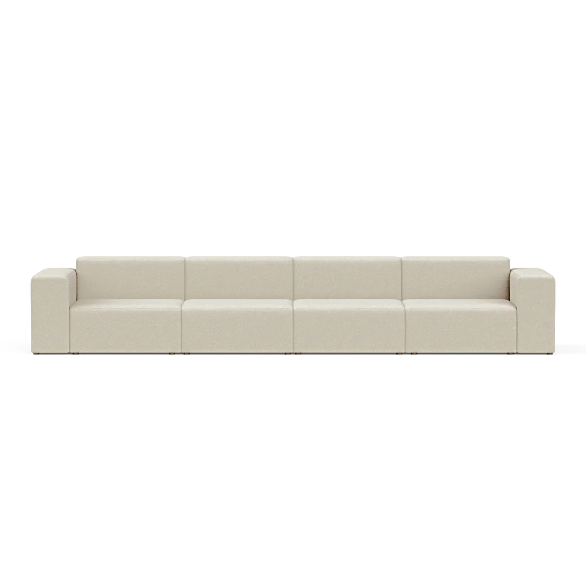 The Four-Seater Form Sectional is a long, beige modular sofa featuring four sections and square armrests. Set against a plain white background, it highlights its minimalist and contemporary design.