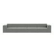 A large, modern Four-Seater Form Sectional in gray is showcased against a plain backdrop. Its minimalist design includes four wide seats and square armrests, offering a sleek and contemporary appearance.