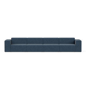 A sleek, contemporary blue Four-Seater Form Sectional featuring flat cushions and simple, straight armrests. It stands on square metal legs and is displayed against a plain white backdrop.