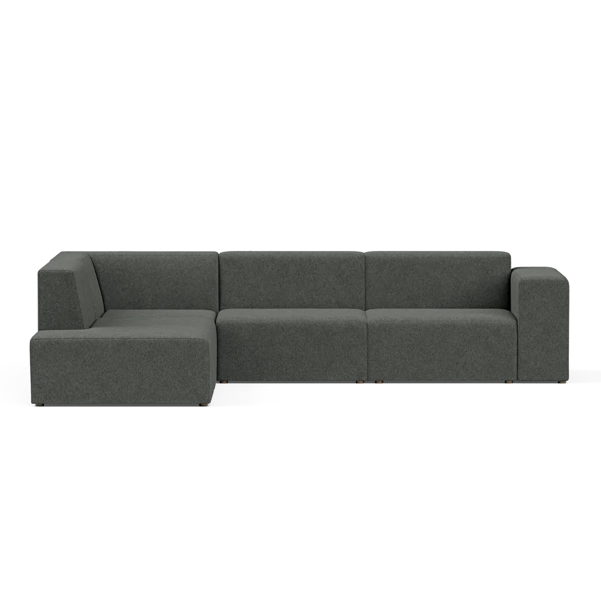The Four-Seater Form Sectional is a dark green modular sofa with a modern design, featuring three main seating sections and a left chaise lounge. Set against a plain black background, the sofa boasts clean lines and a minimalist aesthetic.