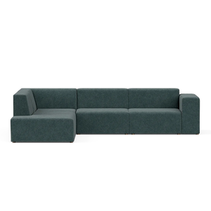 A contemporary Four-Seater Form Sectional in a dark green shade, characterized by its clean lines and low profile. It is arranged on a light-colored surface, consisting of three main sections and an extended chaise to the left, embodying a sleek and minimalist design.