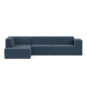 A contemporary sectional sofa called the Four-Seater Form Sectional, featuring a sleek design in navy blue with three interconnected seats and a left-side chaise lounge, set against a plain white background. The design boasts clean lines and minimalist aesthetics.