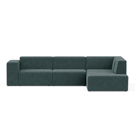 The Four-Seater Form Sectional is a modern, dark teal sectional sofa with a minimalist design. It features a left-hand armrest, three connected seats, and an extended chaise on the right side, positioned against a plain background.