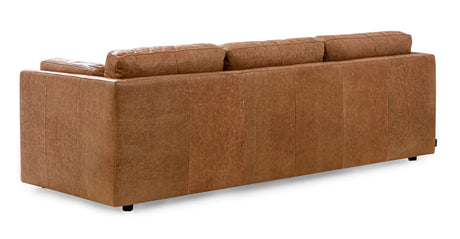 The Domus 93" Leather Sofa in Chestnut is displayed from the back, showcasing its smooth texture and three cushioned backrests. The modern design rests on small, barely visible legs against a plain white background.