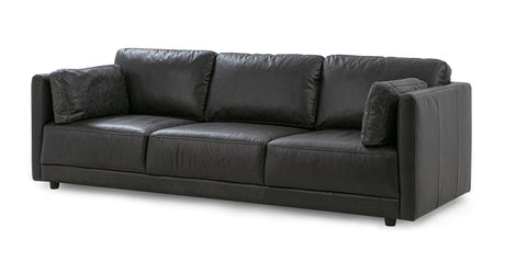 The Domus 93" Leather Sofa, Chestnut is a sophisticated piece featuring three seat cushions with matching back cushions. Its modern design includes square armrests and it comes with two decorative pillows on each end for added style.